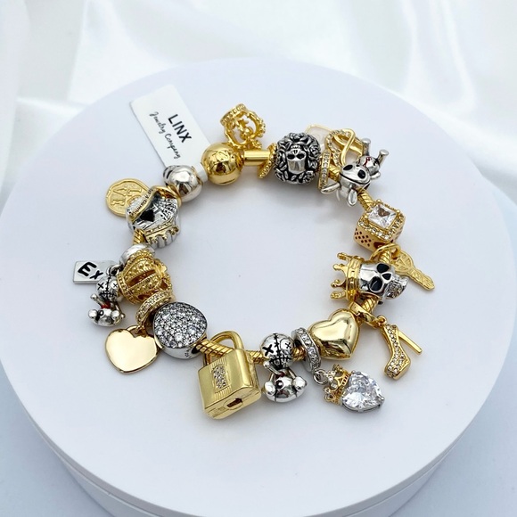 Linx Yellow Gold Snake Chain Bracelet with Skull Themed Charms